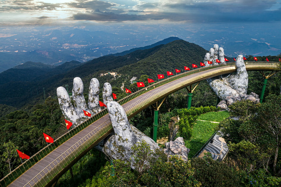 Visitors enjoying a stunning sunrise at Ba Na Hills on a morning tour