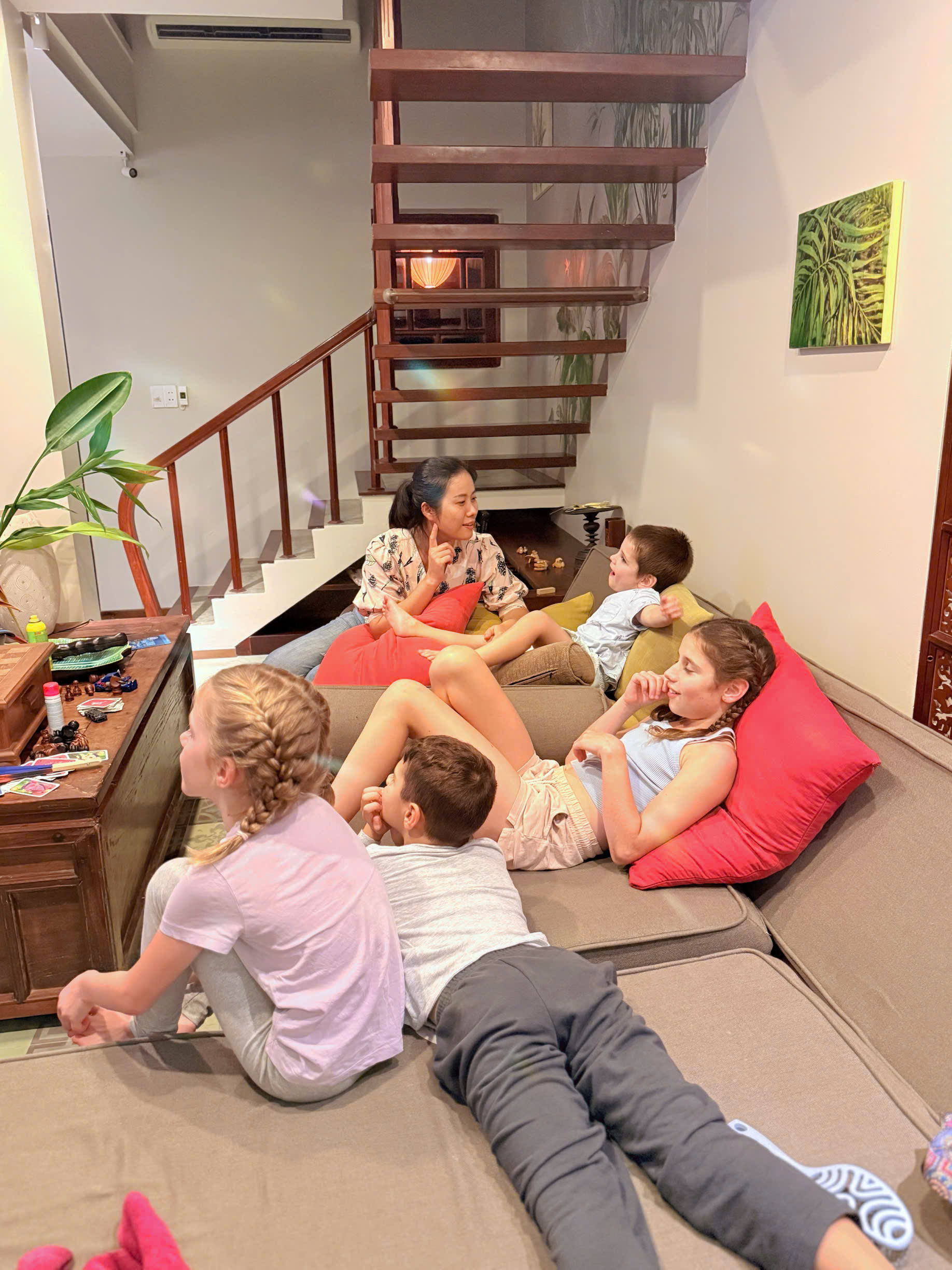 Nanny playing with kids at Hoi An resort