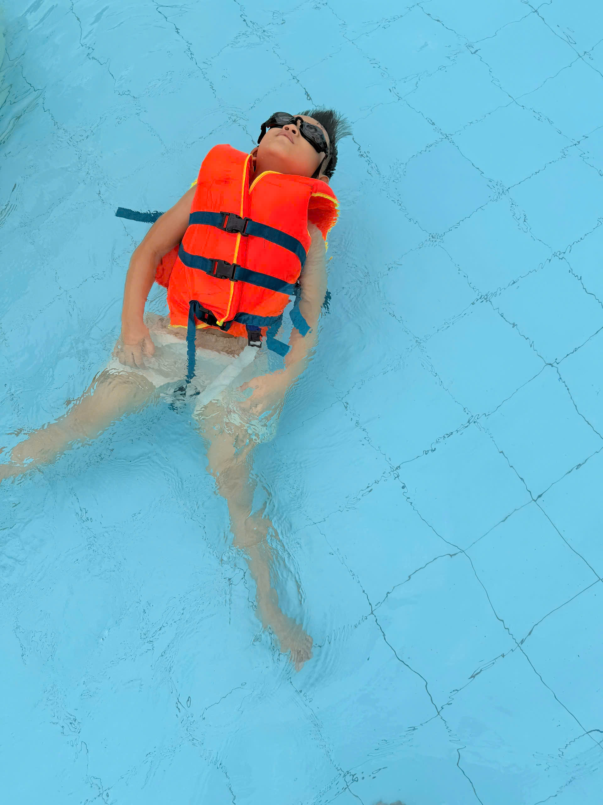 affordable babysitting service Hoi An Vietnam with happy child in hotel room