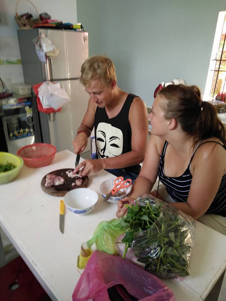 Guests cooking together in a private Hoi An home
